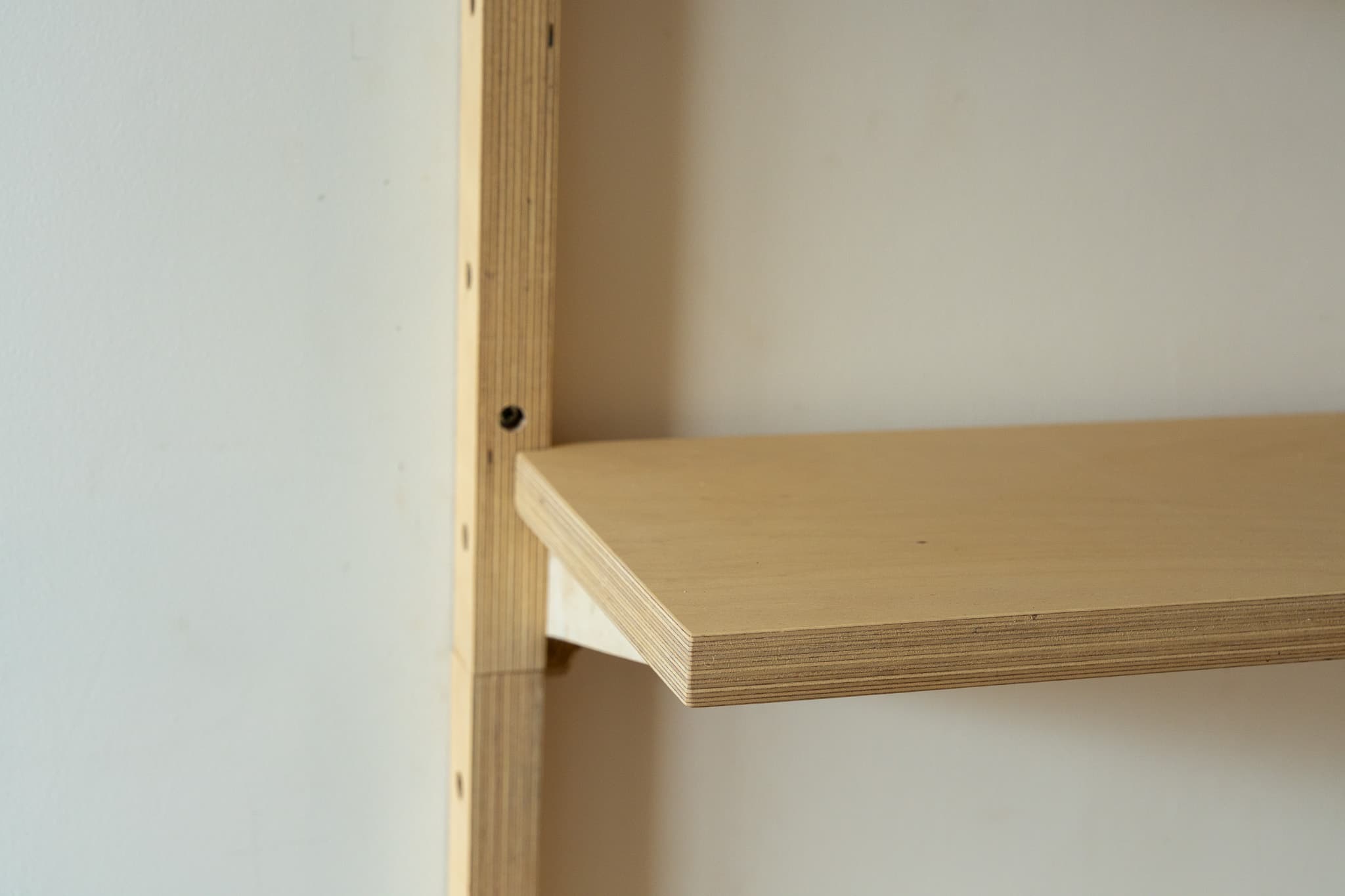 Close view of MESTRA birch plywood shelf edge and rail detail
